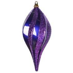 a purple ornament hanging on a white wall