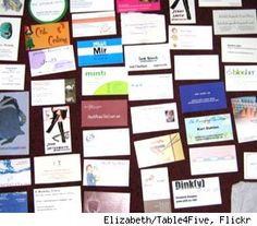 there are many different business cards on the table