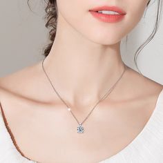 This exquisite pendant necklace features a stunning 1-carat moissanite held securely in a classic four-claw setting, perfect as a sophisticated women's necklace. Ideal for any occasion, it stands out beautifully among your moissanite necklaces and adds a touch of brilliance to your jewelry necklace collection. Embrace the refined beauty of this remarkable moissanite diamond necklace. ✧ Main stone Carat Weight: 1ct ✧ Stone Dimension: 6.5mm ✧ Necklace Length: 18" ✧ Stone Shape: Round ✧ Enhancement Silver Lab Grown Diamond Solitaire Necklace, White Solitaire Necklace With Round Pendant, Lab Grown Diamond Necklace With Single Diamond, Elegant Moissanite Necklace With Single Diamond, Minimalist Moissanite Solitaire Necklace For Formal Occasions, Minimalist Moissanite Solitaire Necklace, Minimalist Formal Moissanite Solitaire Necklace, Diamond White Moissanite Solitaire Necklace, Minimalist Silver Moissanite Solitaire Necklace