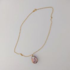 This premium-quality Chinese Freshwater pearl pendant features a bead-nucleated pearl affixed to an 18K yellow gold bail. The pearl has an organically smooth baroque shape, measuring 17-18 by 23mm and weighing 5.2g. If paired with an optional chain, the total weight comes to 6.7g. Displaying a naturally metallic blend of purple, pink, and peach hues, accented by green and pink overtones, the pearl has a luminous glow. The pearl's surface is clear, which allows its stunning beauty to be fully app Gold Baroque Pearl Jewelry With Gemstone, Gold Baroque Pearl Necklace With Gemstone, Gold Gemstone Necklaces With Baroque Pearls, Gold Baroque Pearl Teardrop Pendant, Gold Baroque Pearl Teardrop Pendant Jewelry, Gold Teardrop Pearl Necklace With Gemstone, Tahitian Pearl Drop Necklace As Gift, Tahitian Pearl Drop Necklace For Gift, Luxury Teardrop Pearl Necklace Gift