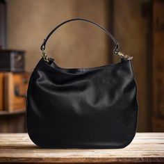 Add a pop of color to your outfit with our handcrafted Leather Hobo Bag in Black for women. This stylish Shoulder Bag features a convenient zipper closure and is expertly crafted in Italy. Made with high-quality real leather, this luxury purses  is both functional and fashionable, perfect for any occasion. Stand out from the crowd with this unique and trendy accessory. FUNCTIONAL INTERIOR * A large central compartment to hold your daily essentials. * Two open pockets for quick access to your eve Staud Luxury Black Bag, Functional Interior, Real Leather Bags, Bag With Zipper, Hobo Bags, Luxury Purses, Stylish Shoulder Bag, Large Handbags, Everyday Accessories