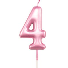 a pink birthday candle with the number four on it