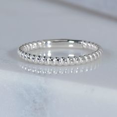 This twisty SCS recycled sterling silver ring is such a versatile piece. Wear it alone, or as part of a stack, really cute as a midi ring too! Reminiscent of friendship bracelets, this is a lovely way to show you care to yourself or someone special.   Design Specifications:   - Type: Ring - Material: SCS recycled sterling silver - Width: 1.8mm - Thickness: 1.5mm - Finish: Polished - Profile: Spiral pattern with sizing bar White Gold Rings Simple, Sterling Silver Toe Rings, Dresses Traditional, Gold Rings Simple, Spiral Ring, Silver Toe Rings, Spiral Pattern, Midi Ring, White Gold Jewelry