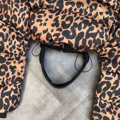 These leopard print puffer jackets really make a fashion statement. If you're looking for a winter coat that will stand out from the crowd. Trendy Leopard Print Winter Outerwear, Hooded Leopard Print Winter Outerwear, Trendy Leopard Print Outerwear For Fall, Puffy Coat, Stand Out From The Crowd, Medium Brown, Winter Coat, Fashion Statement, Sunglasses Case