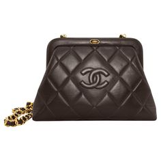 Incredibly stunning Chanel frame style bag from the 1980s. Deep chocolate brown quilted supple leather with contrasting warm gold hardware. Push down on the snap closure tab to open the frame and reveal the iconic maroon leather interior that all vintage Chanel bags have. Optional crossbody/shoulder chain strap. The chain strap rings flip down and are hidden if carrying this as an evening clutch. The chain strap is very long at 28", great if you are very tall. It can be knotted to sit slightly h Vintage Chanel Purse, Vintage Chanel Bags, 80s Handbags, Bri Aesthetic, Chanel Vintage Bag, 1980s Chanel, Vintage Chanel Bag, Chanel Clutch, Luxury Bags Collection