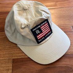 Brand: Ralph Lauren Polo Jeans Company Style: Baseball Hat /Cap Size: One Size - Adjustable Color: Tan With Red/White/Blue Logo Comes From A Smoke-Free, Poodle Friendly Home Condition: Preowned But Never Worn. Has Been In Storage So Some Wrinkles As Shown In Picture Hat Is From Mid To Late 90’s. Came From Younkers Department Store Back In The Day Ralph Lauren Hat, Ralph Lauren Hats, Polo Jeans, Blue Logo, Vintage Polo, Baseball Hat, Hat Cap, Department Store, Red White Blue