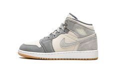 The Air Jordan 1 Mid SE GS “Coconut Milk/Particle Grey” is the youth-sized version of the versatile colorway that combines a cream-colored base with grey suede overlays.  From Jordan Brand’s Spring 2022 collection, the “Coconut Milk” features a coconut-colored canvas base with contrasting Particle Grey suede overlay panels and Swoosh branding.  An old school “Wings” logo graces the collar.  A Particle Grey Jumpman with “Air” branding is embroidered on the top of the Coconut Milk canvas tongue. Jordan Ones, Air Jordan 1 Mid Se, Cute Nike Shoes, Shoe Inspo, Cute Nikes, Stadium Goods, Nike Air Jordan 1, Kids Jordans, Printed Swim