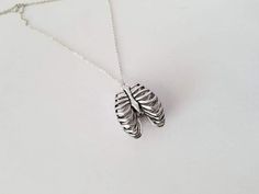 This anatomy inspired necklace features a sturdy silver 3 dimensional ribcage.  It measures 1.5" tall by 1.25" wide.Your choice of a silver chain included....choose from 18 20 22 or 24".Thanks! Ribcage Necklace, Symbol Necklace, Inspired Necklace, Wire Necklace, Cameo Necklace, Rib Cage, Bling Jewelry, Stainless Steel Chain, Chain Lengths