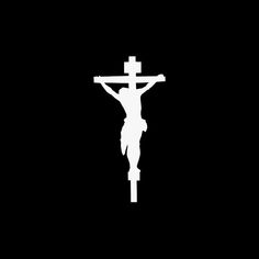 a white crucifix on a black background