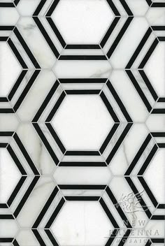 a white and black tile pattern with hexagonal shapes on it's sides