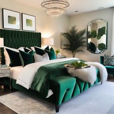 a bedroom with green velvet bedding and white pillows