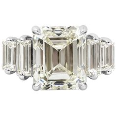 an emerald cut diamond ring with baguetts