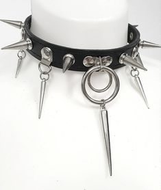 Genuine black leather, 19mm wide. Roller buckle in the back for closing. Spikes are 25mm high. Acrylic spike 50mm long. Acrylic spikes 34mm long. Acrylic spikes 20mm long. Style: rock, gothic, grunge, industrial, punk, harajuku, metal