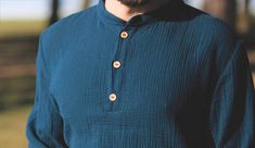 Navy Collared Top With Buttons, Cotton Henley Neckline Shirt With Buttons, Henley Neckline Cotton Shirt With Buttons, Cotton Henley Shirt With Buttons, Navy Button-up Top With Placket, Navy Button-up Top With Buttons, Navy Long Sleeve Tops With Buttons, Navy Casual Tops With Button Cuffs, Casual Navy Tops With Button Cuffs