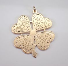 Vintage 14K Yellow Gold Four Leaf Clover Shamrock Charm Pendant. This pendant is 14KT Yellow Gold, measures 34 X 33 mm and weighs 11.0 grams.  There is writing on each of the clover leaves ( Serves God, We Who Serves Deborah, Serves Both, He Who Serves Humanity). I will ship this pendant promptly in a gift pouch.  ADDITIONAL REQUESTS If you would like to see more pictures of this item, please let us know and we would be happy to provide them for you. Please contact us with all questions, we are 14k Gold Medallion Jewelry For Good Luck, Gold Engraved Jewelry For Good Luck, Antique Good Luck Charms Jewelry, Elegant Commemoration Jewelry With Charms, Good Luck Pendant Jewelry Stamped 14k, Good Luck 14k Stamped Pendant Jewelry, Antique Medallion Jewelry For Good Luck, Vintage Engraved Jewelry For Good Luck, Collectible Symbolic 14k Gold Jewelry