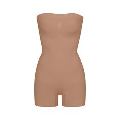 This strapless shortie solution is perfect for cinching your waist, holding in your tummy and core, and smoothing your thighs under mini skirts and dresses. Features pique stitching that supports your bust, an open gusset, and removable adjustable straps that you can wear as shoulder straps, cross back, or as a halter. | SKIMS Strapless Shortie Bodysuit | Medium Neutral | Seamless Sculpt Top Band, Summer Sale, Shapewear, Dress Skirt, Jumpsuit Romper, Casual Dresses, Lounge Wear, Mini Skirts, Stitching