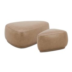 two tan leather footstools sitting next to each other on a white background,