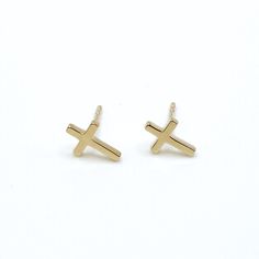 These pretty cross studs are available in 14k yellow or white gold. Our delicate take on this meaningful symbol will quickly become your everyday go-to earrings. available as a single stud or pair stud earring with butterfly backing all material is 14k gold approx. 3/8" tall by 1/4" wide  weight is .86 grams per pair including post & backing Pretty Cross, Cross Stud Earrings, Tiny Tags, Cross Earrings Studs, Summer Ideas, Gold Cross, Chain Choker, Pendant Bracelet, Christmas Wishlist