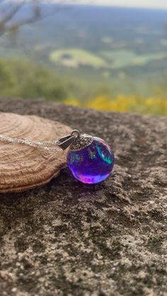 Magical Purple Pendant Necklace, Handmade Magical Purple Jewelry, Purple Handmade Magical Jewelry, Handmade Purple Necklace For Keepsake, Spiritual Purple Round Pendant Necklace, Mystical Resin Necklaces For Gifts, Handmade Purple Resin Jewelry, Mystical Purple Pendant Necklace, Purple Round Resin Jewelry