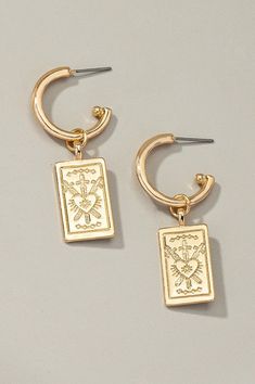 Rectangle drop earrings with etched heart. Made or iron and alloy. Shiny gold plating. Size: 0.5" x 1.25"Made In: China Christmas Coat, Inner Wisdom, Denim Gift, Western Boho, Halloween Jewelry, Stunning Earrings, Unique Earrings, Heart Earrings, Gold Plating