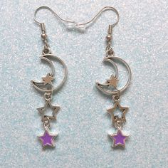 "🌟💜 Adorable celestial crescent moon and dangling star charm earrings! So cute~ measuring at approx 2\" long 💜🌟" Celestial Dangle Earrings With Star Charm, Celestial Style Dangle Earrings With Star Charm, Cute Star Charm Dangle Earrings, Cute Dangle Earrings With Star Charm, Cute Dangle Jewelry With Star Charm, Celestial Crescent Earrings With Star Charm, Star-shaped Metal Earrings With Dangling Charms, Trendy Dangle Earrings With Moon Charm, Celestial Earrings