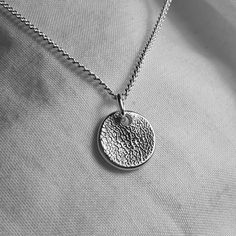 Have your furry friend's nose print captured on a pure silver pendant in the shape of your choice and attached to a sterling silver or leather necklace. Nose prints are unique. much like fingerprints are for humans, so every one is different!  Alternatively I also make pawprint necklaces which can be found here:  https://www.etsy.com/uk/listing/561089333/paw-print-necklace-personalized?click_key=89373383138e71671a1d168c85e3b5ea22d07f4e%3A561089333&click_sum=5360f75f&ga_search_query=pawprint&ref=shop_items_search_3 Once you have placed your order I will send you an easy-to-use kit with enough moulding putty to take two nose prints so that I can choose the best one. It comes with full instructions but if you have any questions or difficulties just get in touch and I will be happy to help :) Dog Nose Print, Dog Lover Jewelry, Paw Print Necklace, Dog Nose, Cat Owner, Shape Of You, Take Two, Pet Memorial, Necklace Personalized