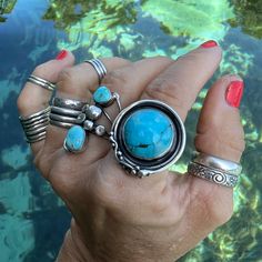 "BLUE TURQOISE RING ---- Handcrafted and set in oxidized STERLING SILVER --- Boho Chic Style ROUND SHAPED STONE --- US Women's Size 7.75 SPRING WATER BLUE ARTISAN MADE BABY BLUE COLORED TURQUOISE STATEMENT RING -- A unique and one-of-a-kind turquoise ring that has been framed in a freeform setting of handcrafted oxidized sterling silver that is typical of the jewelry artist. This piece of wearable art jewelry has been signed and dated by the jewelry artist ~ 2022. SIZE 7.75 (7 3/4) | SOLID Style Unique Blue Adjustable Stackable Rings, Blue Spiritual Open Ring Jewelry, Spiritual Blue Open Ring Jewelry, Bohemian Blue Handmade Stackable Rings, Blue Oxidized Sterling Silver Jewelry, Blue Sterling Silver Jewelry With Oxidized Finish, Artisan Ring With Oxidized Finish, Unique Oval Rings With Oxidized Finish, One Of A Kind Blue Turquoise Ring