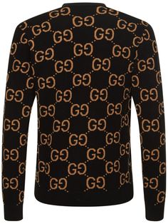 Gucci Cosmogonie. Front button closure. Ribbed collar, cuffs and hem. All over pattern placement may vary. Model is wearing a sizeM Black Designer Gucci Sweater, Gucci Designer Black Sweater, Black Gucci Designer Sweater, Casual Fitted Gucci Sweater, Gucci Designer Jacquard Knit Cardigan, Designer Gucci Jacquard Knit Cardigan, Black Luxury Jacquard Knit Sweater, Gucci Black Winter Tops, Gucci Luxury Tops For Winter