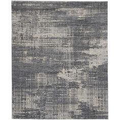 an abstract rug with grey and white colors