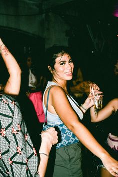 two women are dancing at a party