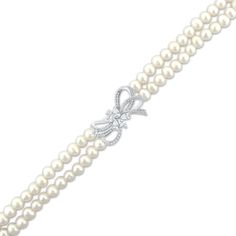 This double-strand cultured pearl bracelet is a chic addition to her wardrobe. Sterling silver Two rows of freshwater cultured pearls create the lovely drape The detailed bow centerpiece shimmers with pear, marquise and round-cut white lab-created sapphires 7.5 inches with lobster clasp Elegant Wedding Jewelry With Butterfly Clasp, Elegant Bracelets With Butterfly Clasp, Formal Pearl Jewelry With Bow, Elegant Silver Bracelet With Butterfly Clasp, Elegant Pearl Bracelet For Party, Bow Centerpiece, Cultured Pearl Bracelet, Bow Bracelet, White Lab