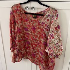 Blu Moon Flowe Top, Zoom In For Detail. Bought At A Sample Sale, Never Worn. Xs But Flowe & Roomy. Shorter In The Front, Longer In The Back. One Tiny Flaw In The Front V Neck Area But I Put A Photo & You Really Cannot See It. It Is A Flowe Drapery Top. Zoom In For Additional Details Of Pattern And Colors. Very Cute. Purple Floral Print Summer Top, Summer Floral Print Purple Tops, Summer Purple Floral Print Top, Summer Festival Blouse With Floral Print, Summer Floral Print Purple Blouse, Summer Purple Floral Print Blouse, Pink Floral Print Festival Blouse, Moon Top, Flower Top