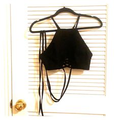 - Black High Neck Crop Top With A Small Cutout In The Front And Long Ties So You Can Wrap It Around Your Body - Made Of Very Soft Fabric And Is Smooth To The Touch - Never Worn! Black Crop Top For The Beach, Black Strappy Halter Top For Night Out, Black Cropped Halter Top For Beach, Casual Black Halter Top For Party, Trendy Black Halter Crop Top, Black Halter Crop Top For Spring, Strappy Casual Crop Top For Night Out, Trendy Black Crop Top Halter, Black Halter Crop Top For Beach