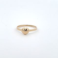 14k solid gold baby ring, ring size 4 stamped 14k gold.  Keepsake gift or midi, or pinky ring.  Model is 9 and wearing on her middle finger.  Puff heart design ring Celebrate with and wear to or gift for the following occasions or styles   :Baptisim :Christmas :Dedication :Birthday :Bridal Party :Midi :First knuckle :Above knuckle  :Daughters first ring Classic Stackable Yellow Gold Heart Ring, Classic Gold Stackable Heart Ring, Classic 14k Gold Heart Ring For Everyday, 14k Gold Heart Ring For Valentine's Day, Classic Gold Heart Ring For Everyday, Gold Hypoallergenic Heart Ring For Promise, Stackable 14k Gold Rings For Valentine's Day, Valentine's Day 14k Gold Heart Ring With Round Band, Yellow Gold Stackable Heart Ring