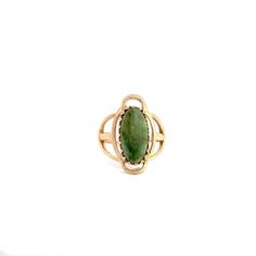 A jade solitaire ring. Bezel set in the center of the ring is an oval shaped jade cabochon.  The ring has a cathedral style profile with an open work top. This ring is a size 5.  This ring includes one free sizing up or down 2 sizes.  Once a ring is re-sized, we guarantee the work but we are unable to offer a full refund on the ring. Please contact us for additional sizing options and an updated shipping time. Stone Information Type: Jade Metal Content Guaranteed 10k yellow gold Weight: 3.0 gram Jade Rings With Polished Finish, Oval Cabochon, Jade Rings With Polished Finish In Oval Cabochon Shape, Jade Oval Cabochon Rings With Polished Finish, Oval Cabochon Jade Rings With Polished Finish, Heirloom Green Oval Cabochon Rings, Classic Oval Chrysoprase Ring, Green Oval Opal Ring, Heirloom Green Oval Opal Ring, Vintage Oval Jade Rings