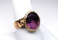 Etruscan Revival Amethyst Glass Solitaire Signet Ring in 14k Gold, Size 9, c. 1800s, 4.80g by EstateOfDecadence on Etsy Antique 14k Gold Amethyst Ring, Victorian Oval Jewelry With Historical Design, Victorian Cabochon Ceremonial Jewelry, Victorian Amethyst Ring In Yellow Gold, Victorian Style Purple Rings In 14k Gold, Victorian Style Purple Ring In 14k Gold, Victorian Yellow Gold Amethyst Gemstone Ring, Victorian Oval Amethyst Ring With 17 Jewels, Wedding Amethyst Cabochon Ring In Fine Jewelry Style