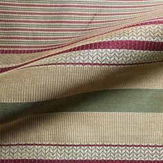 the fabric is striped with different colors and patterns