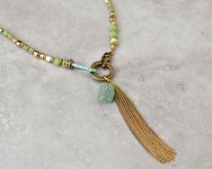 Boho necklace, bohemian necklace, long necklace, pendant necklace, green necklace, gypsy jewelry, gold necklace, beaded necklace, boho chic by petitejewel on Etsy https://www.etsy.com/listing/481478396/boho-necklace-bohemian-necklace-long Collar Verde, Long Leather Necklace, Collar Rosa, Jewelry Gold Necklace, Copper Chain Necklace, Tassel Necklace Boho, Vintage Wedding Jewelry, Long Necklace Boho, Boho Chic Necklace