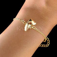 "PERFECT CHRISTMAS GIFT FOR LADIES!! You are getting a dainty, Phantom of the Opera Half Mask Bracelet attached to fine cable original rhodium plated gold tone chain. Charm size is 1/2\" wide X 11/16\" high (12mm X 17mm) Color : Gold The bracelet measures 6 1/2\" long (16.5cm) with 2\" extension chain (5cm). Prices are in US$. For shipping policies and other important information, click on \"profile\" on the right. See an item that you like but has already been sold? Contact me to see if I have Gold Jewelry For Holiday Party, Holiday Party Gold Jewelry, Adjustable Gold Holiday Jewelry, Holiday Adjustable Gold Jewelry, Gold Bracelets For Valentine's Day Party, Holiday Gold Bracelet Jewelry, Holiday Gold Jewelry Bracelet, Gold Christmas Party Bracelets, Gold Bracelets For Holiday Gifts