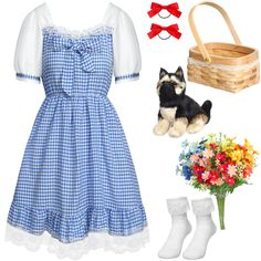 a dog is wearing a blue dress and white socks with flowers in a basket next to it