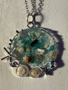 1.5 inch pendant with shells, sea glass and glitter floating in resin.24 inch stainless chain Diy Resin Projects, Resin Projects, Art Resin, Palm Beach Fl, Diy Resin, West Palm Beach, West Palm, Resin Diy, Palm Beach