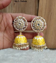 Dark Gold jhumka earrings set. Earrings length: 2.9 inches (with drops) Stud diameter- 1.2 inches Dome Size: 1.1 inches Yellow Latkans Earrings For Wedding, Traditional Yellow Round Earrings, Yellow Drop Earrings For Wedding, Traditional Yellow Earrings With Latkans, Traditional Yellow Latkan Earrings, Traditional Yellow Earrings For Wedding, Yellow Jhumkas With Latkans For Festive Occasions, Yellow Jhumkas For Festivals, Yellow Meenakari Earrings For Diwali