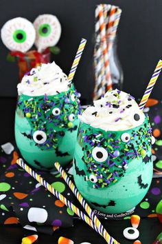 two green drinks with sprinkles and eyes on them