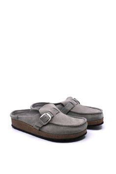 Designed with a sophisticated front and casual back, the Birkenstock Buckley Corduroy Stone Coin Narrow features embossed suede and corduroy stitching for a crafted and durable look. The original footbed offers contoured comfort that molds to your feet over time. Feel luxurious and supported all day long.

Contoured cork-latex footbed creates custom support with wear
Embossed suede upper
Suede footbed lining helps keep you comfortable
EVA sole is flexible and lightweight
Adjustable strap with metal pin buckle
Made in Portugal
Footbed Made in Germany Birkenstock Buckley, Fall Styles, Eva Sole, Metal Pins, Airport Outfit, Mule Clogs, Fall Trends, Birkenstock, Style Guides