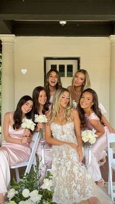 the bridesmaids are all dressed in pink and posing for a photo on their wedding day