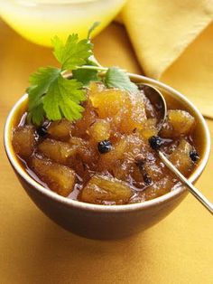 a small bowl filled with fruit and garnish