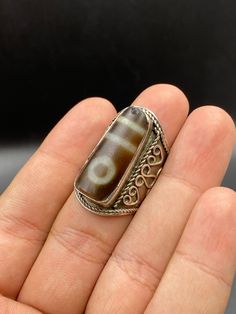 Old Rare Ethnic Tibetan 1 Eye Dzi With 2 Large Strip Ring, Sterling Silver Natural Agate Tibetan Bead, Eye Beads Unisex Ring, Size 9 US Bohemian Brown Rectangular Jewelry, Bohemian Agate Rings, Bohemian Silver Beaded Rings, Bohemian Hand Wrapped Rectangular Jewelry, Hand Wrapped Rectangular Bohemian Jewelry, Bohemian Carved Ring Jewelry, Bohemian Carved Jewelry For Healing, Bohemian Rings With Natural Agate Stones, Bohemian Agate Rings With Natural Stones