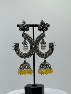 Bollywood Style Jhumka Earrings| Oxidized Tassel Drop Earring| Indian Wedding And Special Occasion Party Wear Jhumka | Teej special gift for her | Indian Tassel Drop Earring Jhumka | Perfect for Indian traditional contemporary look on Wedding, Sangeet, Engagement, Anniversary, Dance Performance, Garba and the Festivals like, Diwali, Eid, Rakshabandhan, Navratri, Durga Pooja, Holi, Mother's Day, Sister's Day, Women's Day or any special occasions. Ideal gift for your loved ones or for yourself. Fusion Style Chandbali Jhumkas With Peacock Design, Fusion Style Peacock Design Chandbali Jhumkas, Yellow Chandbali Temple Jewelry, Traditional Yellow Dual-tone Jewelry, Yellow Jewelry With Latkans For Celebration, Yellow Chandbali Jewelry For Celebration, Elegant Yellow Jhumkas For Festive Season, Yellow Latkans Jewelry For Celebration, Elegant Yellow Jhumkas For Wedding