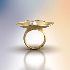 Discover the allure of our Pearl and Diamond Ring, a masterpiece of Italian craftsmanship. This exquisite ring features an 8mm Akoya White Pearl set in your choice of 14k or 18k solid gold—available in yellow, white, or rose gold. Complemented by a 0.1 Ct natural diamond, this ring is a perfect blend of sophistication and timeless beauty. Handcrafted in Vicenza, Italy, this ring embodies the finest traditions of Italian jewelry making. Its organic design, inspired by nature, adds a unique touch Gold Pearl Ring Stamped 14k For Gift, Elegant Silver Rings With Timeless Design, 14k Gold Wedding Jewelry With Timeless Design, Timeless Gold Jewelry With Tension Setting, Elegant Yellow Gold Concave Dome Ring, Modern Yellow Gold Pearl Ring For Anniversary, Luxury 14k Gold Jewelry With Halo Design, Elegant Dome Ring With Tension Setting, Elegant Gold Dome Ring Stamped 14k