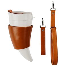 a white cup with brown leather straps and a tan strap for the coffee cup holder